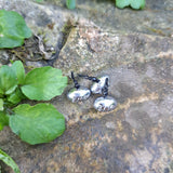 Pond Pro Up-Shot weight 3/16 oz with black wires on a stone surface with green leaves.