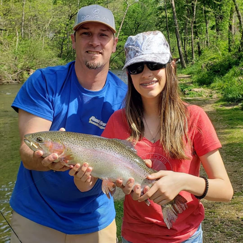 Pond Pro, Tim Shannon and daughter holding large trout caught at Dry Run Creek