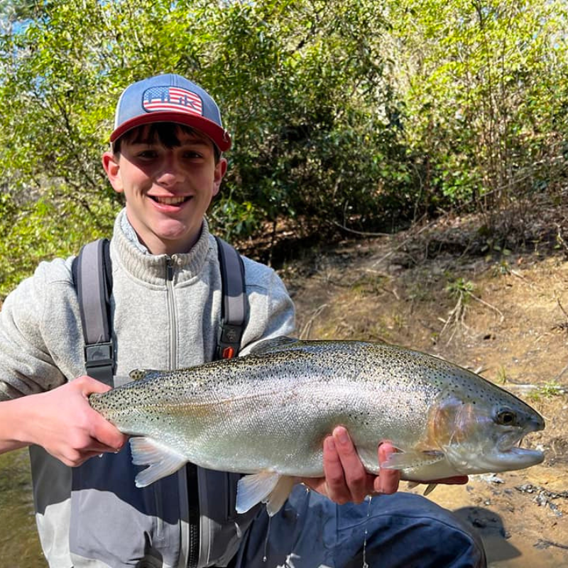 Young boy holding large fish caught at Fighting Town Creek in Georgia