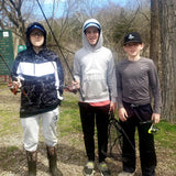 Three young boys about to fish at Dry Run Creek in Arkansas.