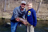 A happy boy who caught a trout at Dry Run Creek in Arkansas, with Guide, Tim Shannon, with Pond Pro
