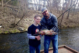Young boy who caught a large trout at Dry Run Creek in Arkansas.