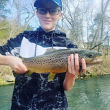 An older boy who caught a large trout at Dry Run Creek in Arkansas.