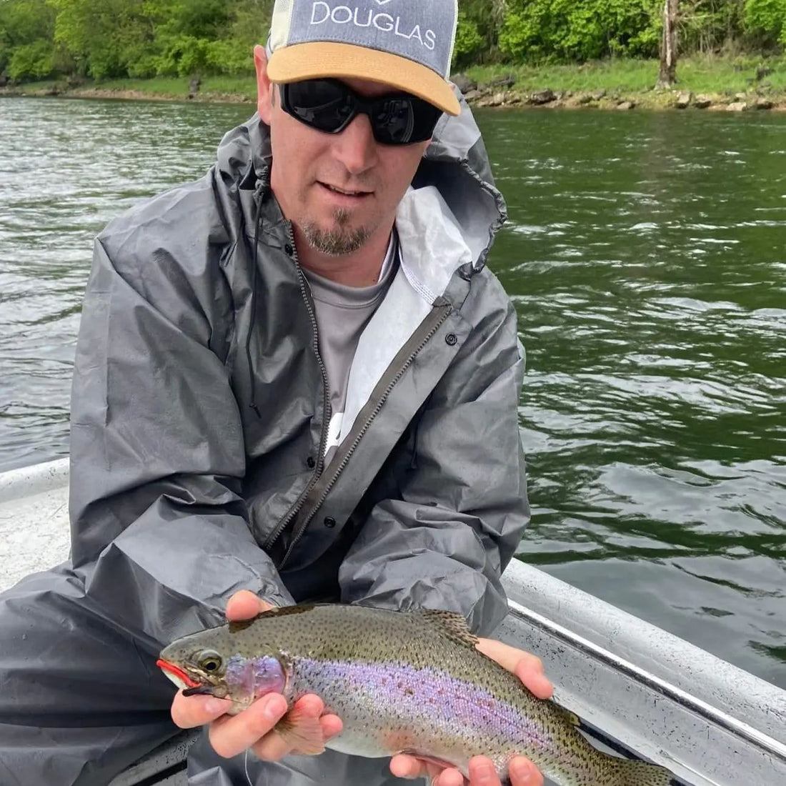 Pond Pro, Tim Shannon, holding a rainbow trout on the North Fork River