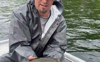 Pond Pro, Tim Shannon, holding a rainbow trout on the North Fork River