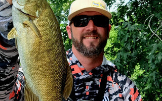 Pond Pro Guide Tim Shannon holding bass