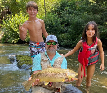 Kids wade fishing in river with Pond Pro, Michael Willet