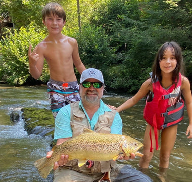 Kids wade fishing in river with Pond Pro, Michael Willet