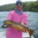 Pond Pro Guide, Tim Shannon, holding a large trout on the White River in Arkansas.