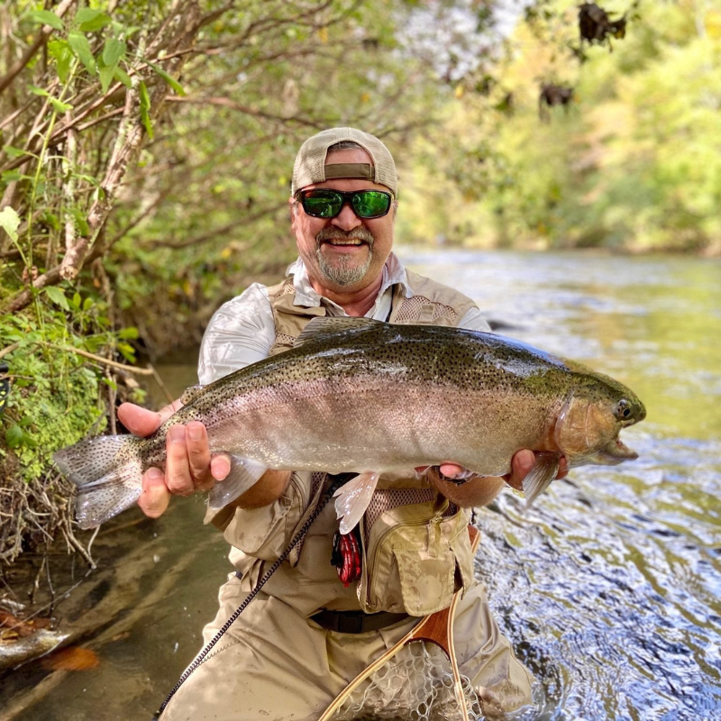 Pond Pro Michael Willet holding a large fish in the river.